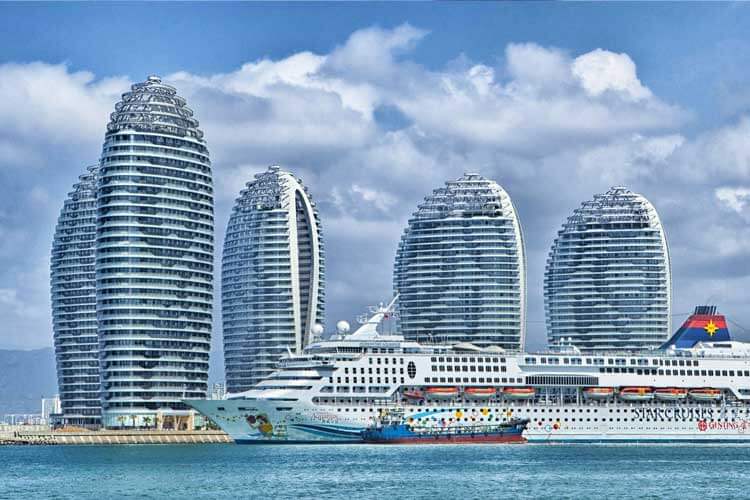 Hotel buildings and a cruise ship to promote Hospitality Career Online Classes